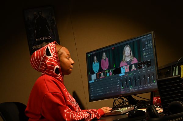 Student works on video project in Greycomm studio