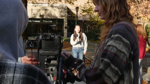 Student does news reporting on Loyola campus
