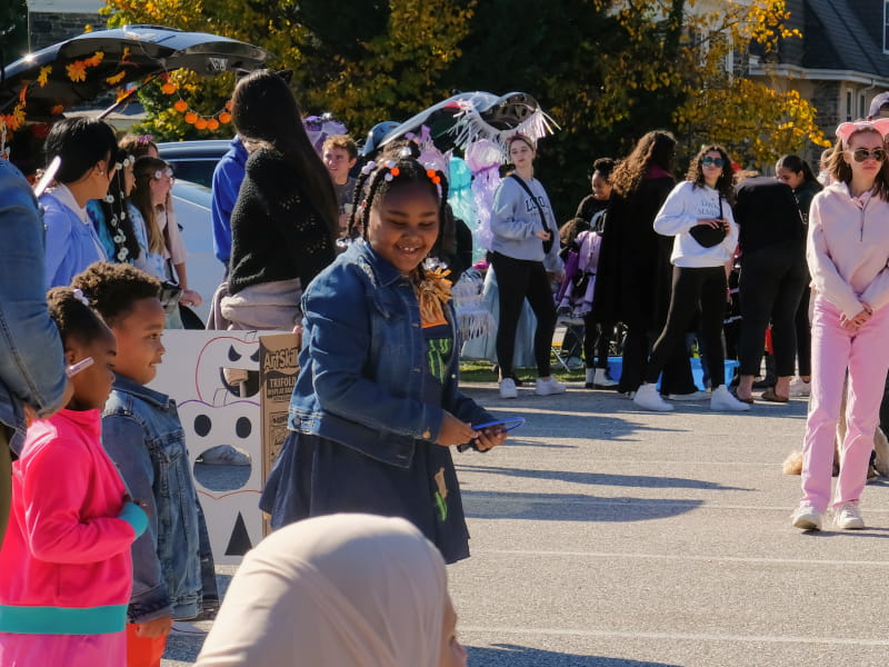 Neighborhood residents gather for a day of fun and festivities.
