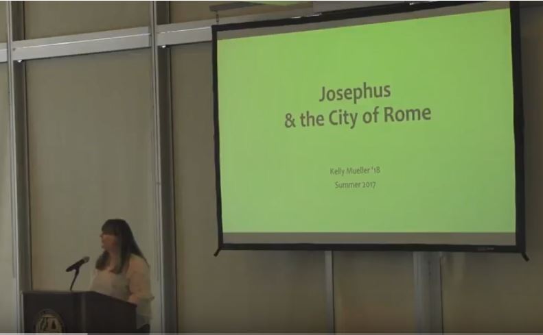 A student at a podium presenting about Josephus & the City of Rome