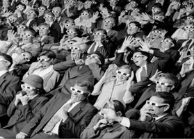 frightened audience gasping at a movie with 3D glasses on 