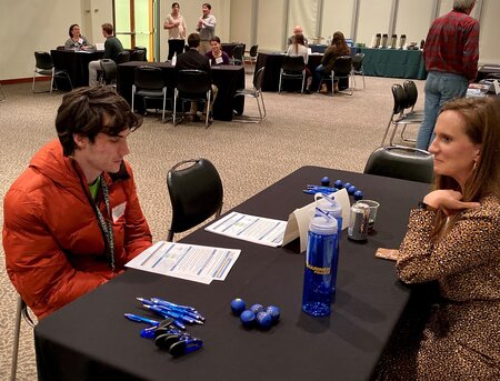 Megan Farley, Credit Risk Portfolio Manager/AVP, Mariner Finance speaking with a student at the 2019 Career Night