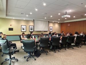 college students sitting at large table