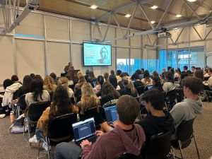 Brian Turner presenting to a large group of college students