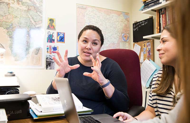 Professor talking with a student in her office