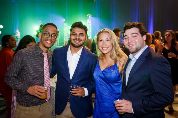 Photo of Loyola alumni at the Bull & Oyster Roast