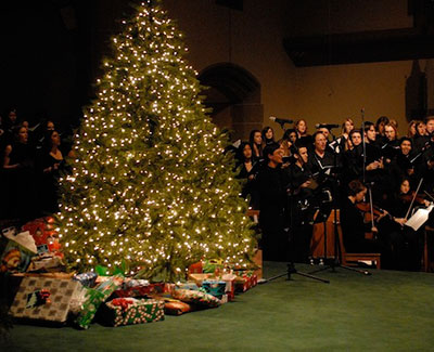 Lessons & Carols Christmas tree with presents underneath