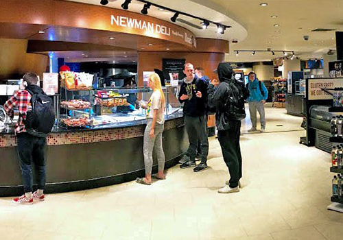 Students shopping at Iggy's Market located in Newman Towers