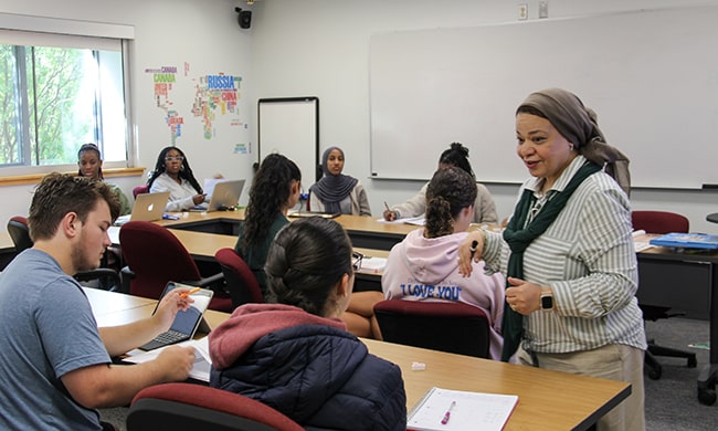 A professor teaches an Arabic class