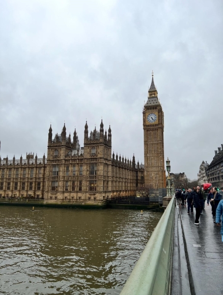 Big Ben, a large clock over looking a river bank in London