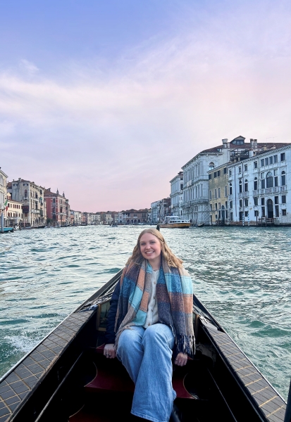 A student in front of a river