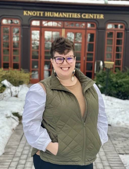 Elise standing in front of the Humanities Building