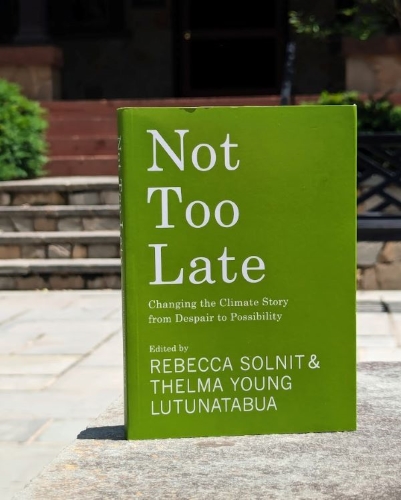 Photo of the common text 'Not Too Late' in front of a Loyola building