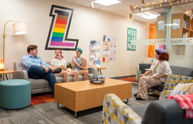 Students sitting on couches in Loyola's Pride Room