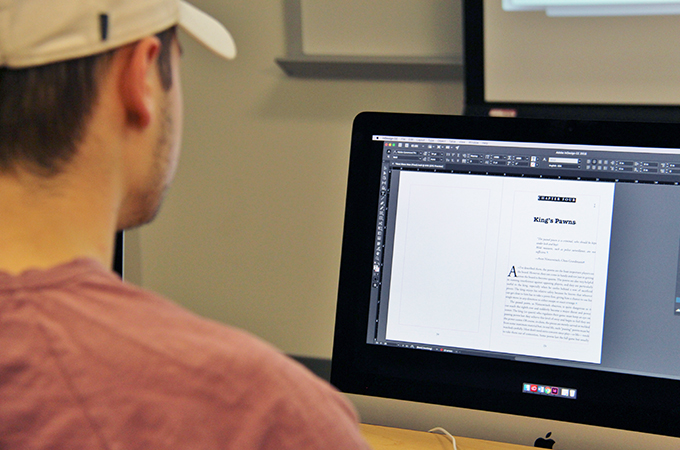 Student checks his typesetting work.