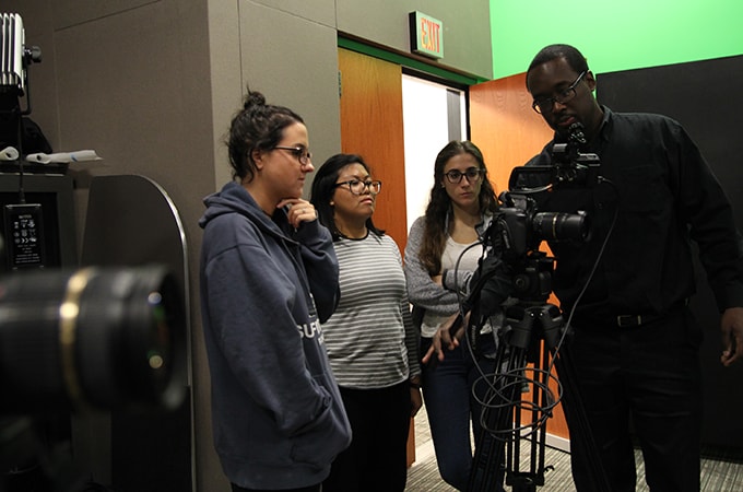 Students receiving instructions on video camera operation