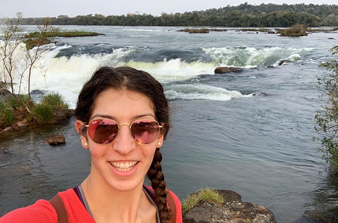 Selfie of Francesca Minicozzi in front of a waterfall