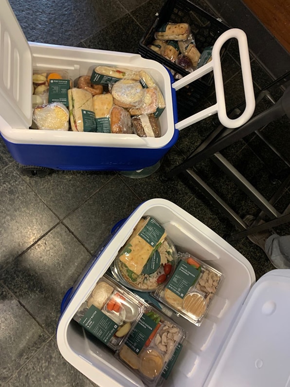 Two coolers full of packaged meals
