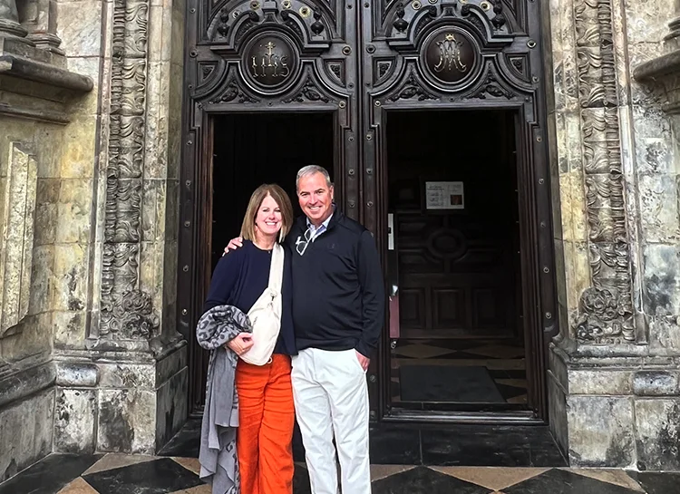 Terrence Sawyer and his wife in front of a basilica