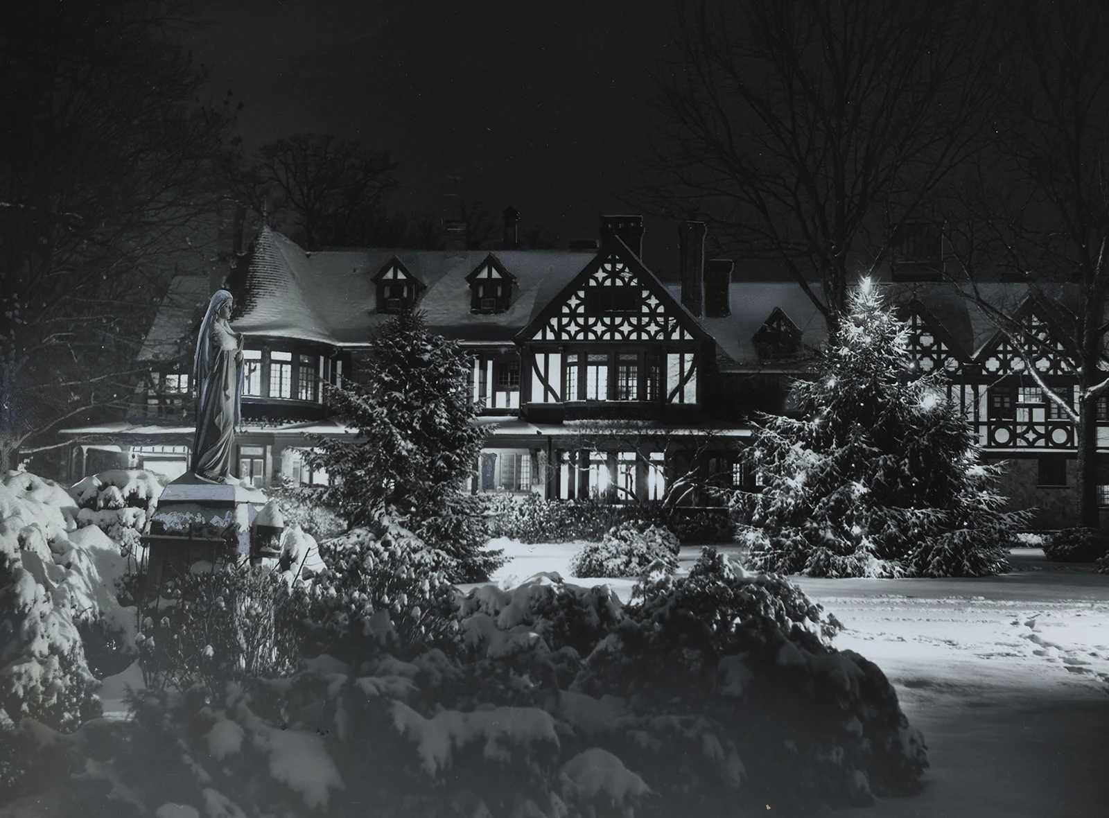 A snowy Humanities building at night