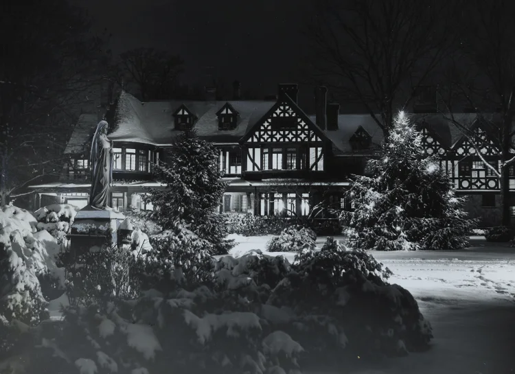 A snowy Humanities building at night