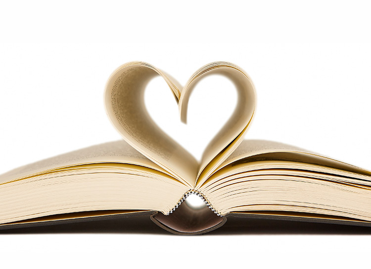 A book with the pages curled up in the shape of a heart