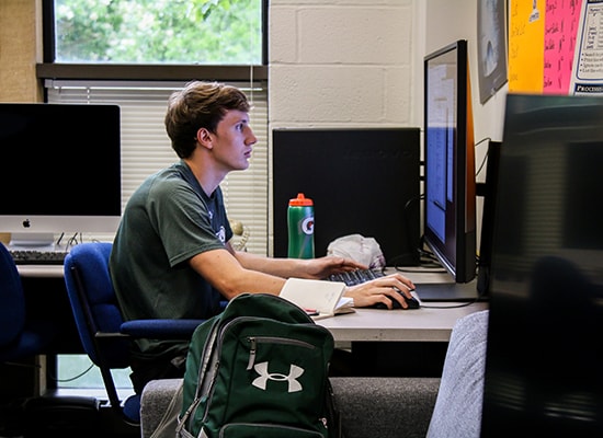 Student working at computer in lab