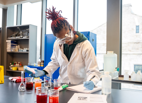 Loyola student in a science lab