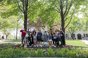 Students with Iggy pose on the Loyola Quad