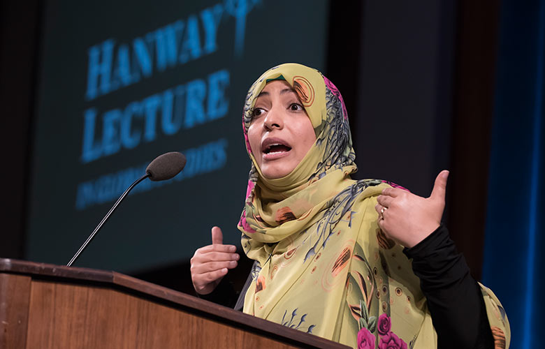 Tawakkol Karman speaking in front of a crowd