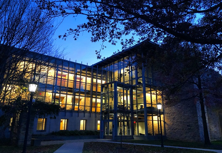 Evening shot of Donnelly Science Center, interior lights illuminating the night