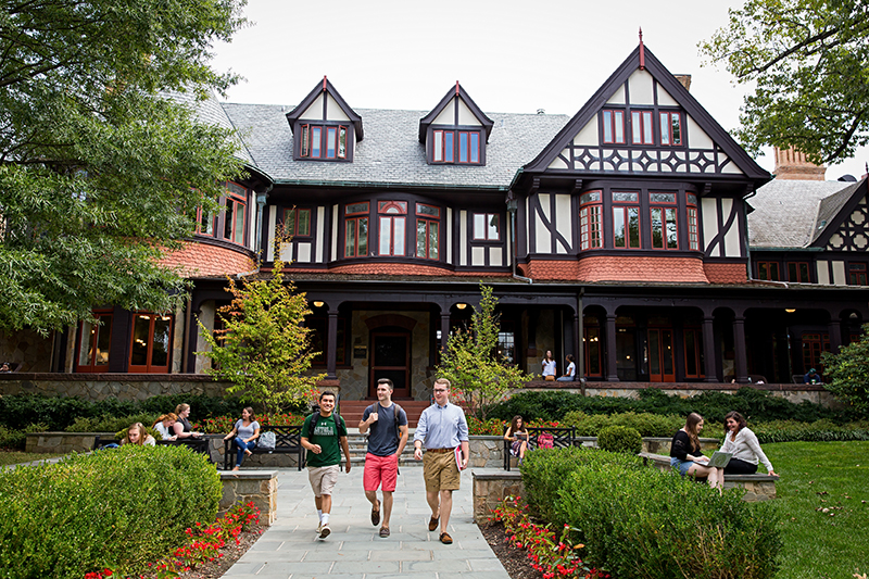 Students walk in front of the Humanities Center on Loyola University Maryland's Evergreen Campus.