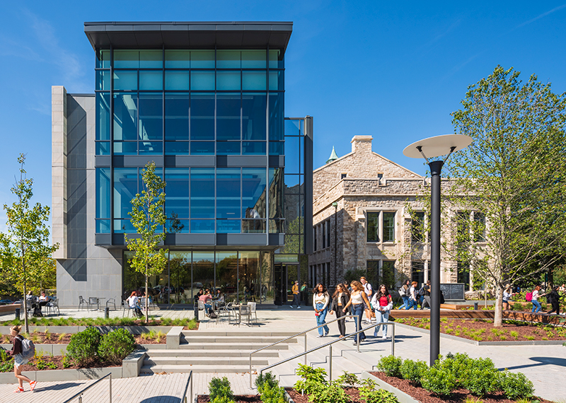 Students walk past the Miguel B. Fernandez Family Center for Innovation and Collaborative Learning on Loyola University Maryland's Evergreen campus.