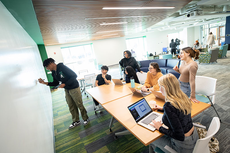 Loyola students working on a group project.