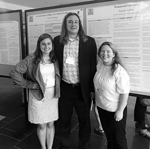 Rob Helfenbein standing with two students who presented at Emerging Scholars
