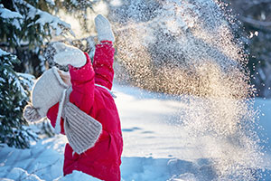 Child playing in snow